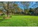 Large, fenced backyard with mature trees at 11716 Buckstone Ln, Charlotte, NC 28277