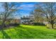 Sunny backyard with lush green lawn at 11716 Buckstone Ln, Charlotte, NC 28277