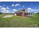 Brick house with screened porch, detached garage, and large yard at 2011 Saye Brook Dr, Monroe, NC 28112