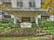 Queen's Oaks building entrance with landscaped flowerbeds at 2222 Selwyn Ave # 504, Charlotte, NC 28207