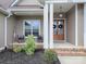 Inviting front porch with double doors and brick steps at 390 Cal Kennedy Rd, Cleveland, NC 27013