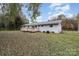 Ranch home with white exterior and wooden deck at 4550 Zion Church Rd, Concord, NC 28025