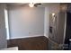 Dining area with dark hardwood floors and a stainless steel refrigerator at 1091 Farm Pond Ln, Rock Hill, SC 29732