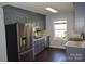 Kitchen boasts gray cabinets, stainless steel appliances, and granite countertops at 1091 Farm Pond Ln, Rock Hill, SC 29732