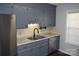 Kitchen features gray cabinets, granite countertops, and stainless steel appliances at 1091 Farm Pond Ln, Rock Hill, SC 29732