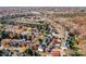 Aerial view showcasing a neighborhood with houses and fall foliage at 157 Montibello Dr, Mooresville, NC 28117