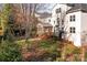 Landscaped backyard with screened porch and deck at 157 Montibello Dr, Mooresville, NC 28117