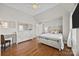 Well-lit bedroom with hardwood floors and a comfortable bed at 157 Montibello Dr, Mooresville, NC 28117