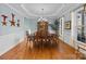 Formal dining room with hardwood floors, chandelier, and built-in hutch at 157 Montibello Dr, Mooresville, NC 28117