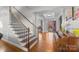 Spacious entryway with hardwood floors, piano, and staircase at 157 Montibello Dr, Mooresville, NC 28117
