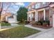 Brick home with a front porch and attached garage, nicely landscaped at 157 Montibello Dr, Mooresville, NC 28117
