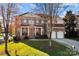 Two-story home with brick facade, red roof, and attached two-car garage at 157 Montibello Dr, Mooresville, NC 28117