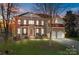 Brick two-story house with a red roof and a large front yard at 157 Montibello Dr, Mooresville, NC 28117