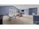 Game room with ping pong table and couches at 157 Montibello Dr, Mooresville, NC 28117