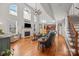 Two-story living room with hardwood floors, fireplace, and high ceilings at 157 Montibello Dr, Mooresville, NC 28117