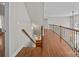 Upstairs hall with hardwood floors and a view of the piano at 157 Montibello Dr, Mooresville, NC 28117