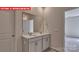Double vanity bathroom with modern fixtures and a large mirror at 8000 Kennesaw Dr, Gastonia, NC 28056