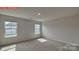 Spacious bedroom with large windows and carpet flooring at 8000 Kennesaw Dr, Gastonia, NC 28056
