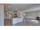 Open concept kitchen and Gathering room with island and fireplace at 8000 Kennesaw Dr, Gastonia, NC 28056