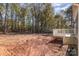 Small deck with white railings off the back of the home overlooking the backyard at 1014 Wesbrooke Ct, Bessemer City, NC 28016