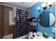 Bathroom with blue walls and a shower/tub combo at 1840 Findlay St, Gastonia, NC 28052