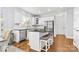 Modern kitchen with white cabinets and island at 320 Three Greens Dr, Huntersville, NC 28078