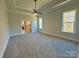 Spacious main bedroom with carpet, ceiling fan and ensuite bath at 3850 Willow Grove Ln # 24, Concord, NC 28025