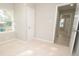 Well-lit bedroom with carpet, window, and closet at 403 N Ransom St, Gastonia, NC 28052