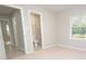 Bedroom with carpet, window, and access to bathroom at 403 N Ransom St, Gastonia, NC 28052