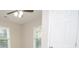 Bedroom featuring two windows, ceiling fan, and a closet at 403 N Ransom St, Gastonia, NC 28052