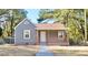 Gray house with wood accents, landscaping, and a walkway at 403 N Ransom St, Gastonia, NC 28052