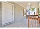 Front porch with white door and wood railing at 403 N Ransom St, Gastonia, NC 28052