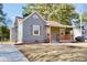 Charming gray house with a covered porch and wood accents at 403 N Ransom St, Gastonia, NC 28052
