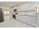 Modern kitchen with stainless steel appliances and light cabinets at 403 N Ransom St, Gastonia, NC 28052