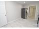 Kitchen with stainless steel refrigerator and light walls at 403 N Ransom St, Gastonia, NC 28052