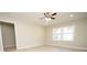Living room with light walls, ceiling fan, and hardwood floors at 403 N Ransom St, Gastonia, NC 28052
