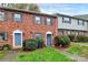 Brick townhouse with landscaping and a walkway at 6019 Heath Valley Rd, Charlotte, NC 28210