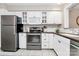 Updated kitchen, featuring stainless steel appliances and white cabinetry at 6019 Heath Valley Rd, Charlotte, NC 28210