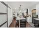 Modern kitchen with white cabinets, quartz countertops, and a large island at 720 E Park Ave, Charlotte, NC 28203