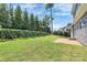 Landscaped backyard with privacy hedge and patio at 911 Naples Dr, Davidson, NC 28036