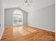 Hardwood floor bedroom with vaulted ceiling and large window at 922 Clover Park Dr, Clover, SC 29710