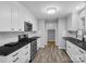 Modern kitchen with white cabinets, subway tile backsplash, and dark countertops at 922 Clover Park Dr, Clover, SC 29710