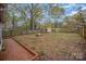 Spacious backyard with fire pit and shed at 408 W 5Th Ave, Gastonia, NC 28052