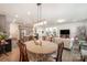 Open dining area with a round table and chairs, overlooking the living room and kitchen at 6133 Mariemont Cir, Charlotte, NC 28226