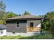 Charming craftsman style home with dark gray siding and a front porch at 16 Cherry St, Badin, NC 28009