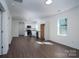 Modern kitchen featuring white cabinets, stainless steel appliances, and granite countertops at 16 Cherry St, Badin, NC 28009