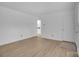 Living room with wood-look floors and access to the kitchen at 2328 Danforth Ln, Charlotte, NC 28208