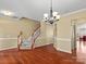 Hardwood floors and staircase in a bright dining room at 3645 Brookville Sw Ave, Concord, NC 28027