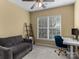 Home office with a comfortable sofa and a modern standing desk at 3645 Brookville Sw Ave, Concord, NC 28027