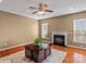 Spacious living room with hardwood floors, fireplace and ceiling fan at 3645 Brookville Sw Ave, Concord, NC 28027